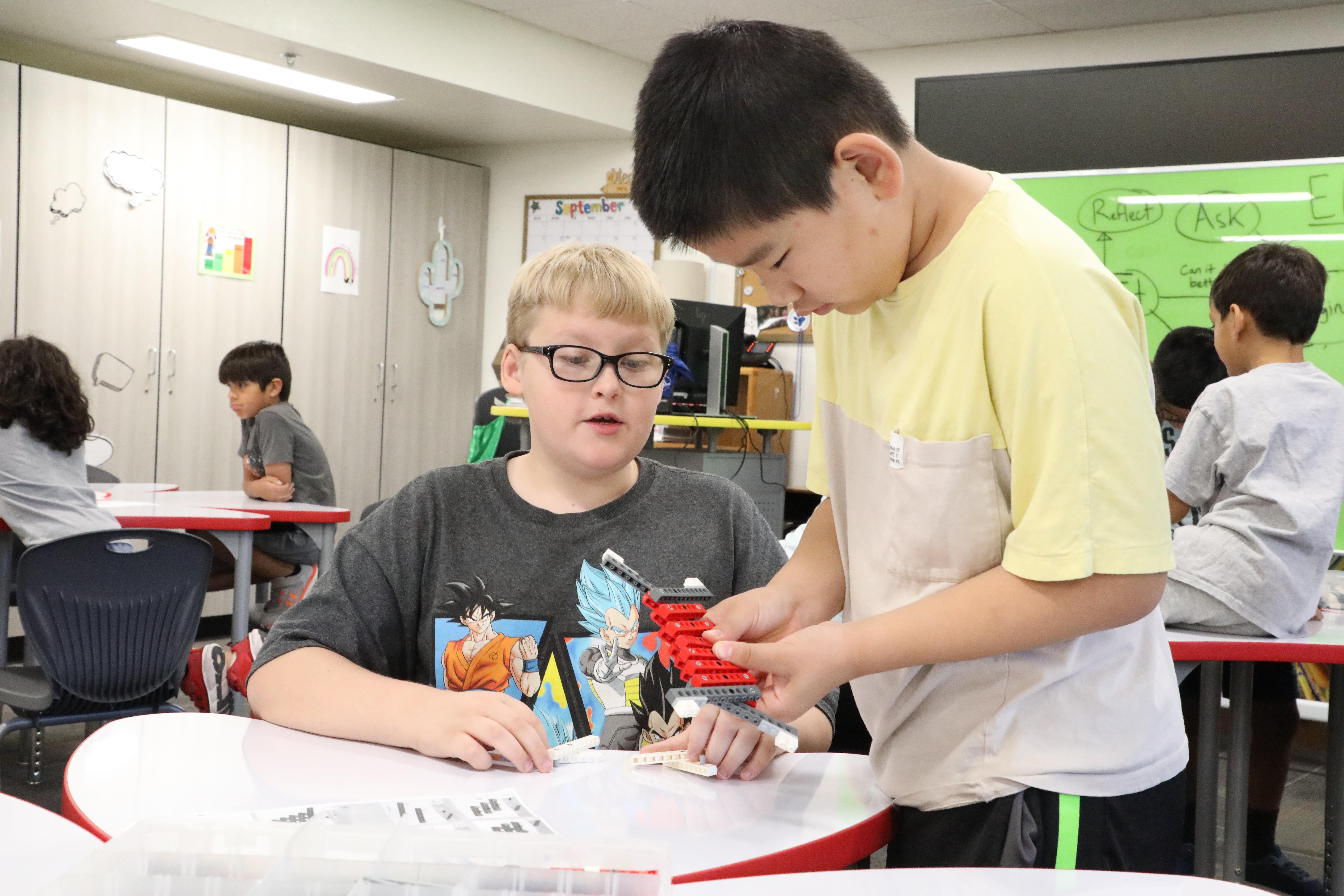 Image of 2 students doing a LEGO project